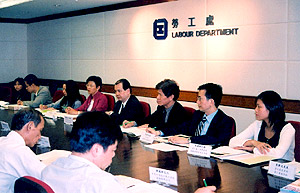 The Permanent Secretary for Economic Development and Labour, Mr Matthew Cheung Kin-chung (fourth from right), attending a tripartite committee meeting.